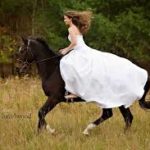 bride arriving by horseback in an Italian wedding
